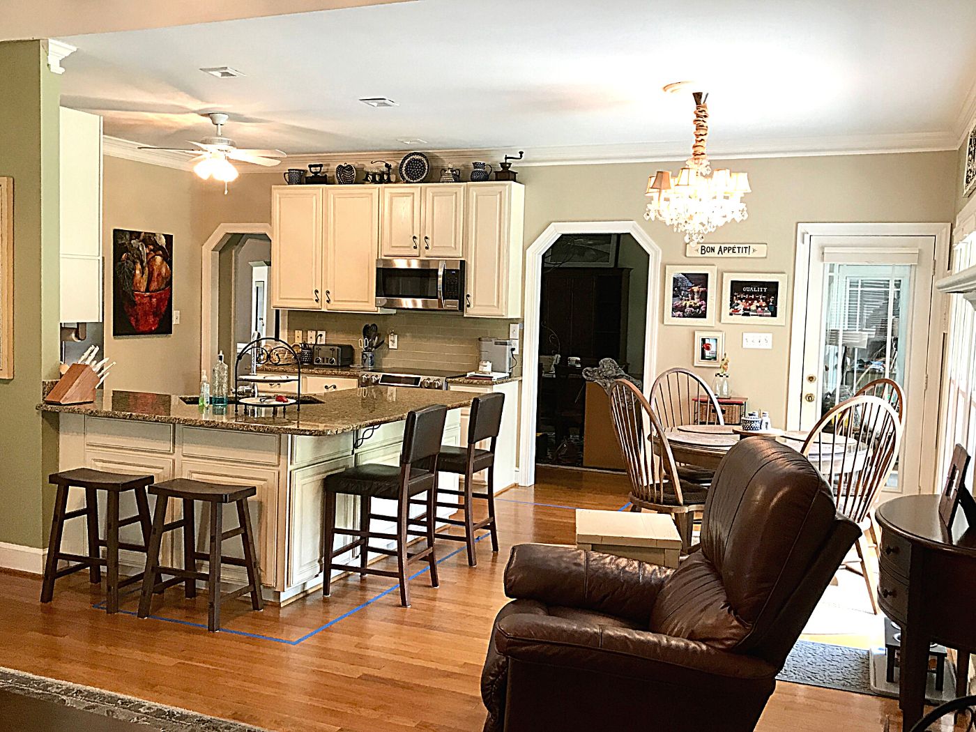 Kitchen remodel before photo of perimeter wall with 2 open doorways to adjacent dining room and a 3rd door to the back porch 