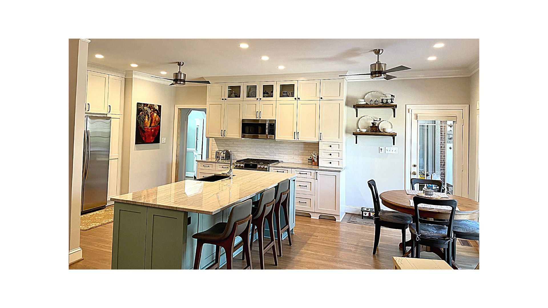 Kitchen Remodel Open Concept Green Island with Classic Gray Perimeter Cabinets Quartzite Countertop White Tile Backsplash Farmhouse Sink Refinished Hardwood Floors